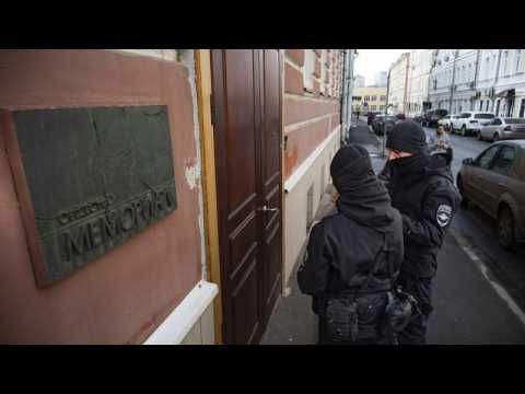 Police in Russia detain human rights activists after raids on offices and homes