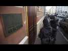 Police in Russia detain human rights activists after raids on offices and homes