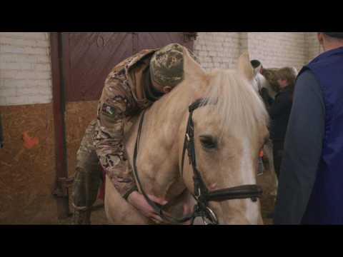 Ukrainian soldiers ride out war stress with horse therapy