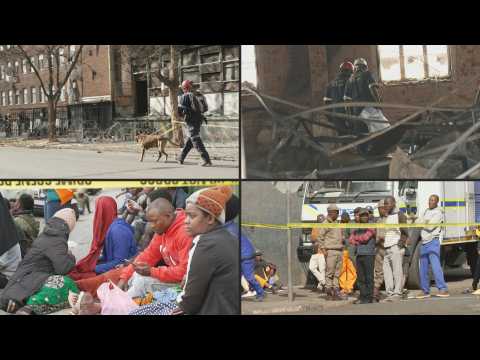 Families wait as K9 teams search building in aftermath of S. Africa fire