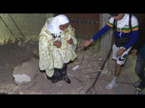 People inspect damage after a powerful earthquake rattled Morocco