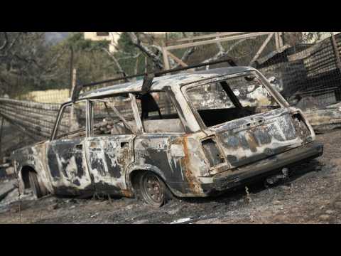 Fire destroys cars, houses near Athens as Greece battles blazes