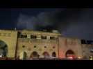 Smoke rises over Arbil's Qaysari bazaar after a fire breaks out