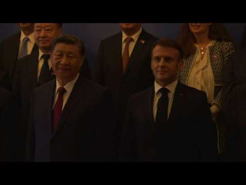 Presidents Xi and Macron pose for the media