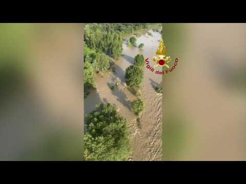 Aerials: Firefighters survey severe flooding in northern Italy