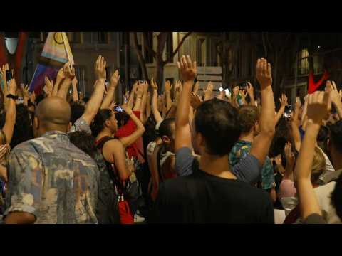 Demonstrators in Marseille celebrate the results of the French general elections