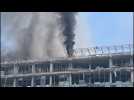 Smoke rises from damaged buildings in Kyiv after Russian attacks