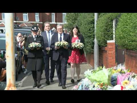 UK Prime Minister lays flowers at scene where three children killed and others injured