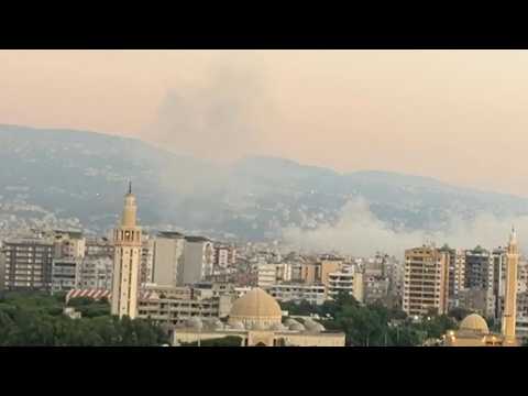 Smoke billows over the southern suburb of Beirut following Israeli strike