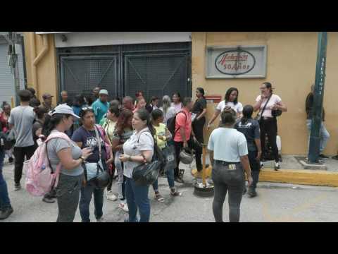 Families of arrested anti-government protesters gather outside Caracas detention center