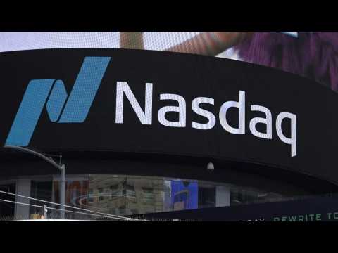 Images of Nasdaq MarketSite building as stock markets plunge