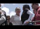 Venezuelan opposition leader Maria Corina Machado rides toward anti-Maduro election protest