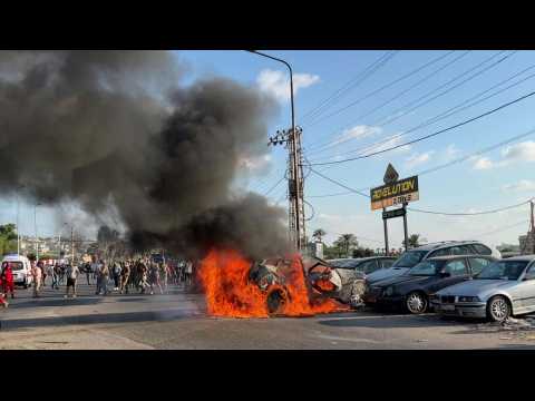 Burning wreckage after Israeli strike kills Hamas official in Lebanon