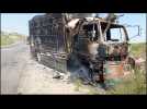 Pakistan: Burnt out vehicles on highwway after gunmen kill dozens