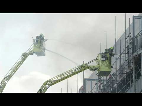 Firefighters tackle fire at London flats