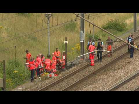 Police, railway employees work along train tracks in northern France