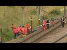 Police, railway employees work along train tracks in northern France