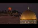 Super Blue Moon rises behind Jerusalem's Dome of the Rock