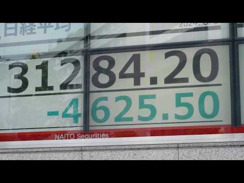 Images of Tokyo Stock Exchange as Nikkei dives 12.4%