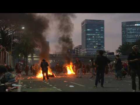 Indonesian protesters gather outside parliament to protest election law change