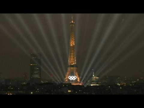 Eiffel Tower illuminates during the Olympic opening ceremony