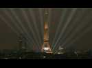 Eiffel Tower illuminates during the Olympic opening ceremony
