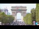 Paris rallume la flamme paralympique sur les Champs-Elysées