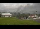 New Caledonia: Smoke billows on the horizon after overnight riots - Label : AFPTV - First images - Category : News