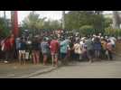 People queue outside supermarket in New Caledonia's Noumea