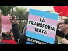 LGBTIQ+ activists march against decree describing transsexuality as 'mental disorder'