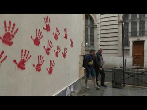 Holocaust memorial and facades in Paris hit with red hand graffiti