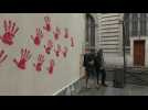 Holocaust memorial and facades in Paris hit with red hand graffiti