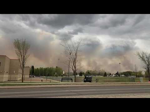 Queues of cars evacuate from Canada's Fort McMurray as wildfire menaces town