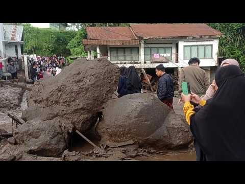 Indonesians inspect damage from deadly flash floods