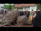 Indonesians inspect damage from deadly flash floods