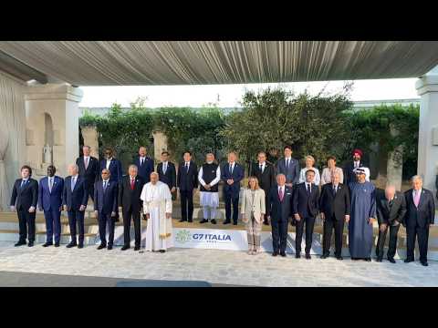 G7 leaders and guests pose for group photo during Italy summit
