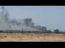 Gunfire rings out as smoke rises over Rafah