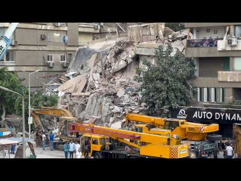 Emergency crews at the site where a building collapsed in Cairo