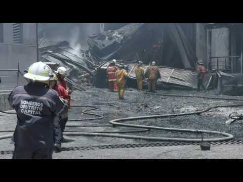 Firefighters battle to extinguish motorbike warehouse blaze in Caracas