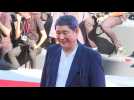 Japanese director Takeshi Kitano walks Venice's red carpet for his movie 'Broken rage'