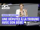 Une députée monte à la tribune du Bundestag avec son bébé dans les bras