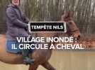 Tempête Nils : Village inondé : il circule à cheval